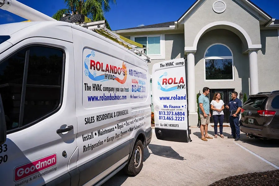 Rolando's HVAC service vehicles at a customer's home